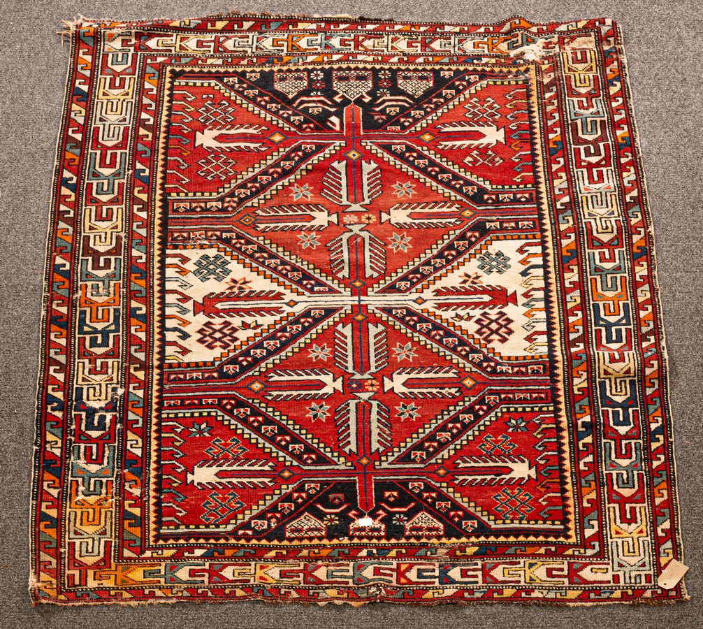 A Shirvan rug, South Caucasus, circa 1930, with red and ivory cruciform medallions,