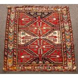 A Shirvan rug, South Caucasus, circa 1930, with red and ivory cruciform medallions,