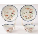 A pair of Chinese famille rose teacups and saucers sets, Yongzheng,