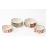 Two pairs of Oriental stacking famille vert bowls, 19th Century, decorated flowers and fruits bands,