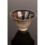 Eric James Mellon (1925-2014) a small nude footed bowl, 2008, bean ash glazes, blue, red and lustre,