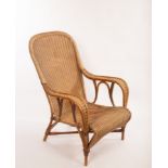 A Dryad rattan chair with arched back and seat on down swept arms, labelled to back,