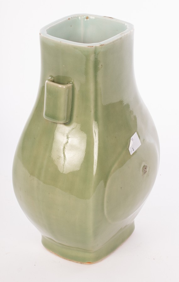 A Chinese monochrome celadon porcelain vase with two handles, Guaner Fanghu, Qing Dynasty, - Image 3 of 4