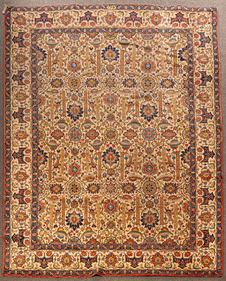 A fine Tabriz carpet, North West Persia, circa 1940, the ivory field of leafy vines, flowerheads,