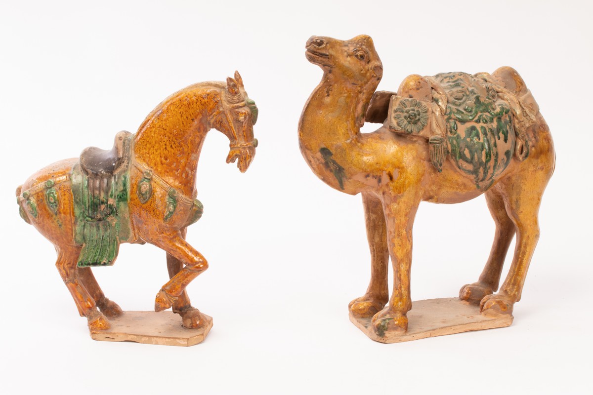 Two Chinese Tangsancai terracotta animals, one horse, 28cm high and one camel, 31cm high,