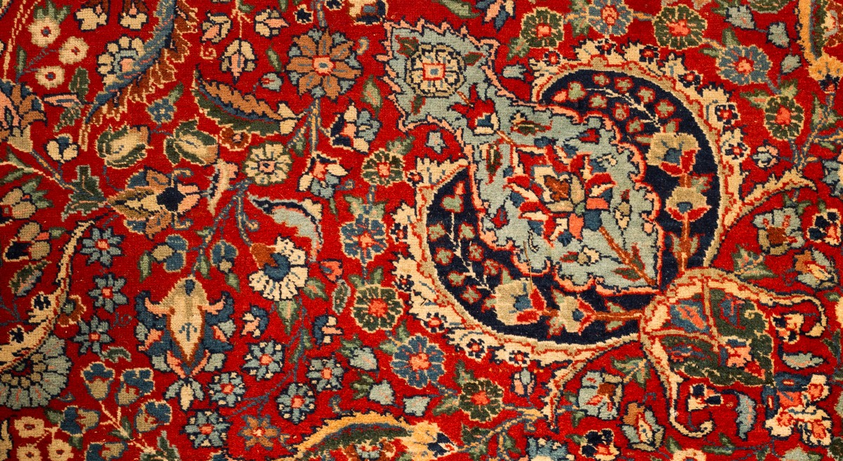 A Tabriz carpet, North West Persia, the madder field with an indigo medallion, - Image 4 of 11