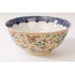 A Chinese famille vert wavy rim porcelain bowl, Kangxi, the exterior decorated with flowers, birds,