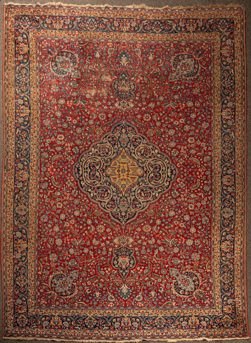 A Tabriz carpet, North West Persia, the madder field with an indigo medallion,