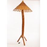 A decorative bamboo floor standing lamp, mid 20th Century, in the manner of Louis Sognot,