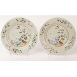 A pair of Chinese famille rose porcelain plates, Qianlong, decorated with peonies, cranes,