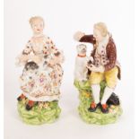 A matched pair of Derby figures of a boy and a girl with a cat and a dog, no. 51, 13.