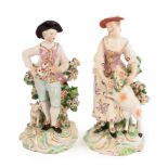 Two Derby figures of a shepherd and shepherdess, circa 1775, with bocage,