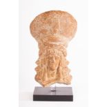 An Egyptian terracotta head of Isis-Aphrodite, Roman period, circa 1st Century BC,
