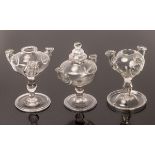 Three lacemaker's lamps, two with three branches and the twin-lamp with cover,