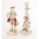 A Derby figure of a shepherd with flowers and a candlestick figure of a shepherdess,