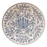 A large Wincanton Delftware circular dish, circa 1730-50, painted in blue with the Mimosa pattern,