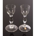 Two 18th Century wine glasses, with ogee bowl and plain stem with central swelling knop,