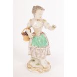 A Meissen figure of a girl with a flower basket, lace trims,