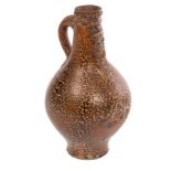 A Rhenish Bellarmine bottle, second half 17th Century, with an all-over 'tigerware' glaze,
