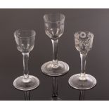 Three 18th Century wine glasses with ogee bowls, plain straight stems and folded feet,