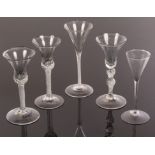 Three 18th Century air twist drinking glasses with waisted bell bowls and two toasting glasses,