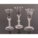 Two 18th Century wine glasses with bell bowls, one engraved with a bird and grapes,