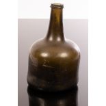 A mid 18th Century green glass wine bottle of mallet form with trailed string rim,