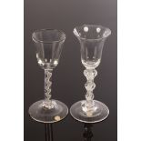 Two 18th Century wine glasses, one with a rounded funnel bowl on a stem with single spiral gauze,