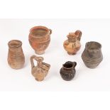 A selection of Greek and Roman pottery, comprising a Roman Modiolus or grain measure,