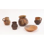 A selection of European pottery excavated items, comprising a Medieval stoneware cooking pot,