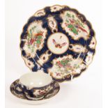 A Worcester blue scale ground teacup, saucer and lobed plate, circa 1770,