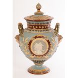 A Mettlach stoneware two-handled vase and cover in the majolica style,