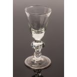 An 18th Century heavy baluster goblet, the rounded funnel bowl with solid base,