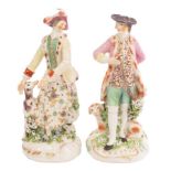 A near pair of Derby figures of hunter and companion,