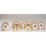 A set of nine Spode bone china dessert plates painted with fruit, signed M.