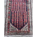 A Hamadan runner, West Persia, the indigo field of Herati design,