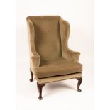 A George III mahogany wingback armchair,