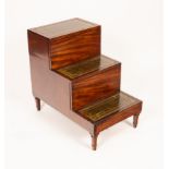 A late George III mahogany bedside three step commode, with leather inset steps,