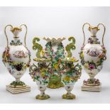 A pair of Continental porcelain vases, oviform with double-lipped neck,