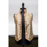 A fine late 18th Century cream silk satin waistcoat embroidered with stylised flowers in polychrome