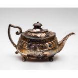 A 19th Century silver teapot, makers marks worn, engraved decoration on four ball feet,