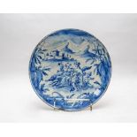 A Savona maiolica circular tazza painted with a Bacchic scene, 18th Century,