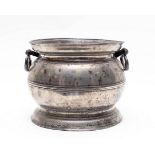A pewter two-handled chamber pot, 17th Century,