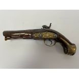A Spanish percussion pistol, mid 19th Century, the walnut grip with brass mounts,