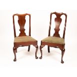 Two similar 18th Century mahogany dining chairs with splat backs and trap seats on cabriole legs