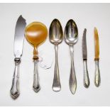 A Danish silver handled serving spoon and knife, set with horn simulate,