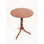 An early 19th Century mahogany table, the circular top on turned column and tripod support, 57.