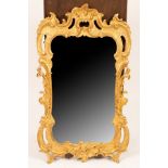 A George II giltwood and gesso framed cartouche shaped mirror, with a pierced rocaille frame,