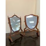 A 19th Century mahogany framed shield shaped toilet mirror, 51cm high, another similar, 50.