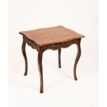 A Continental oak side table with a shaped serpentine top, the carved frieze fitted a drawer,